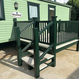 An example of a fully installed 12' x 6' end patio with steps and a gate in the dark green colour