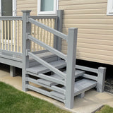 An example of a fully installed 8' x 3' entry platform with steps, with light grey decking and cream railings