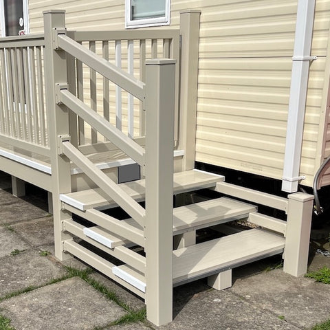 An example of a fully installed 12' x 3' 10" walkway with steps and a gate in the cream colour