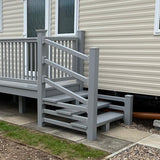 An example of a fully installed 6' x 3' 10" entry platform with steps and a gate in the light grey colour